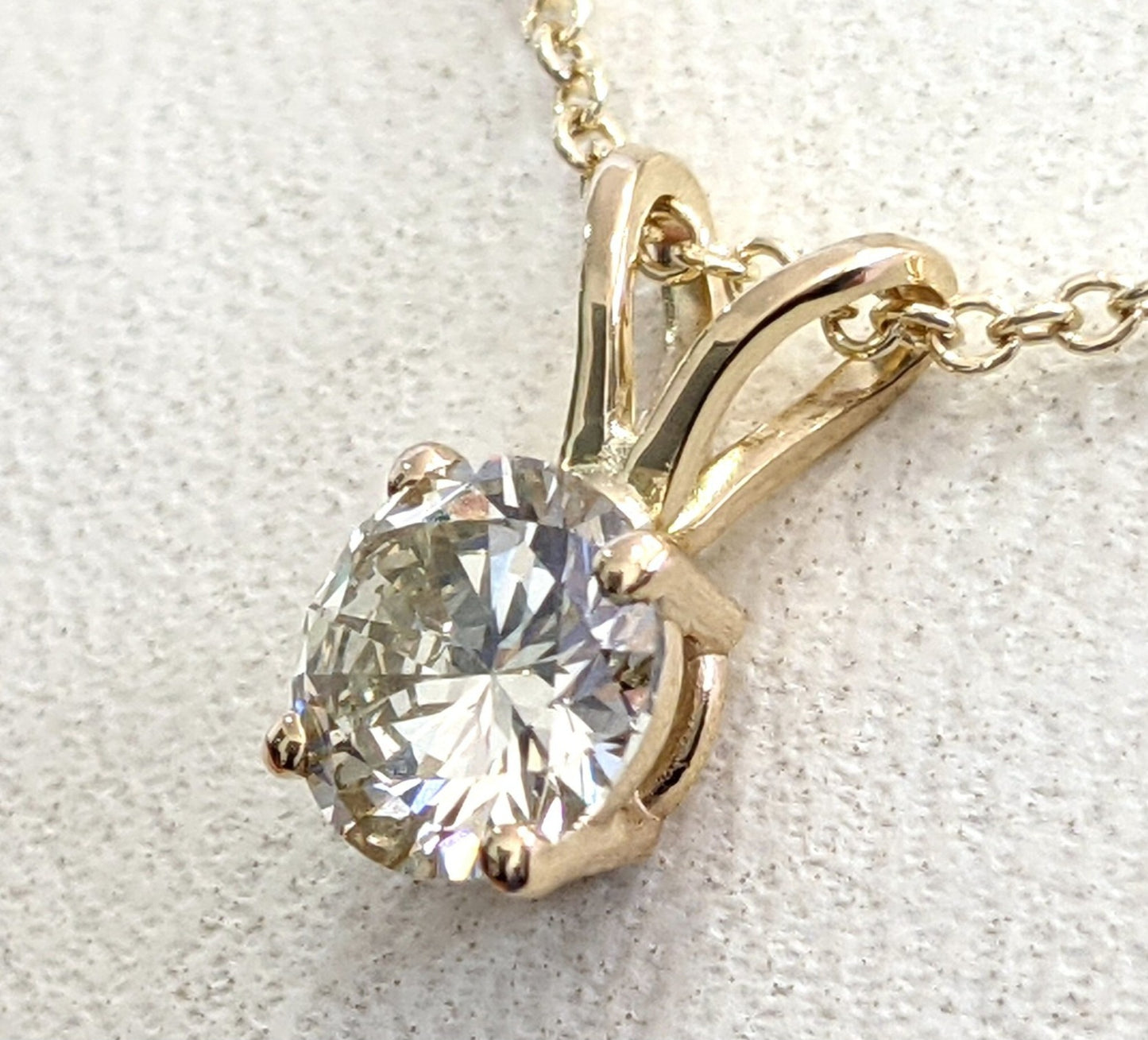 Ciondolo punto luce in oro e diamante naturale certificato IGI 0.30ct D IF